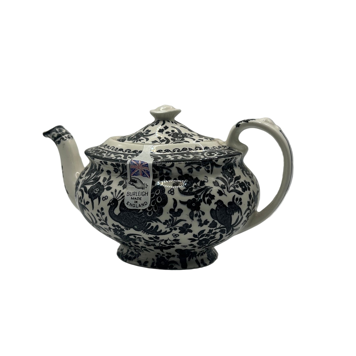 Decorative teapot with black floral patterns on a white background